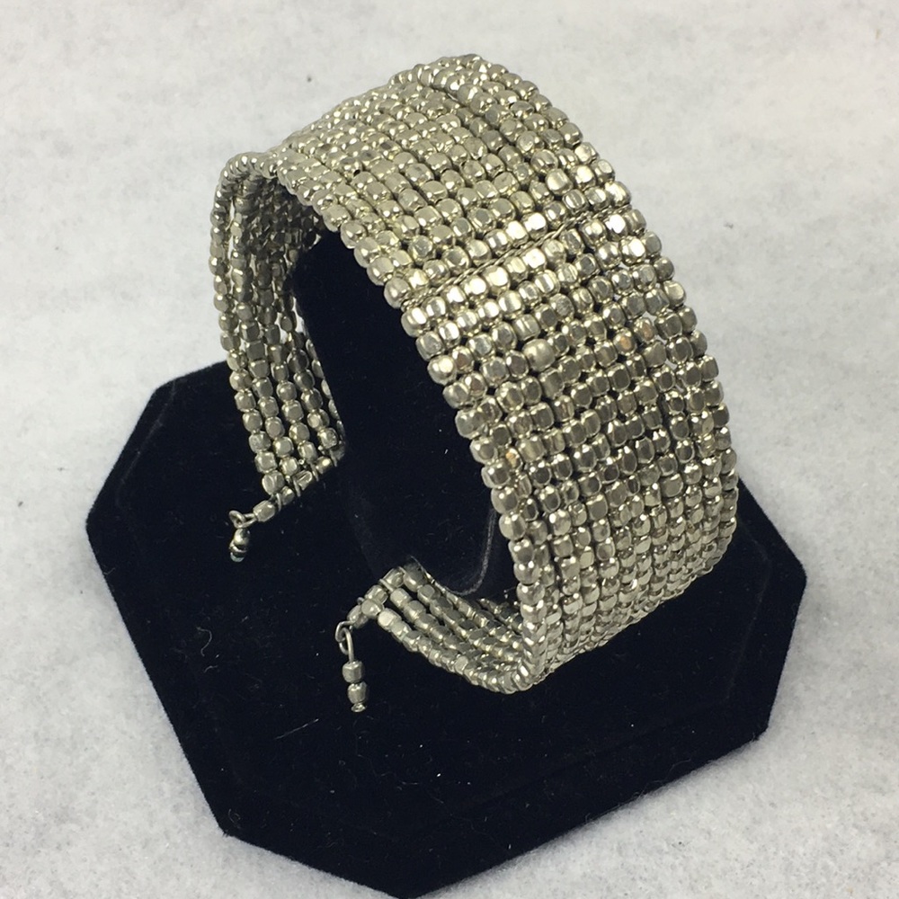 Wide cuff silver colored bracelet